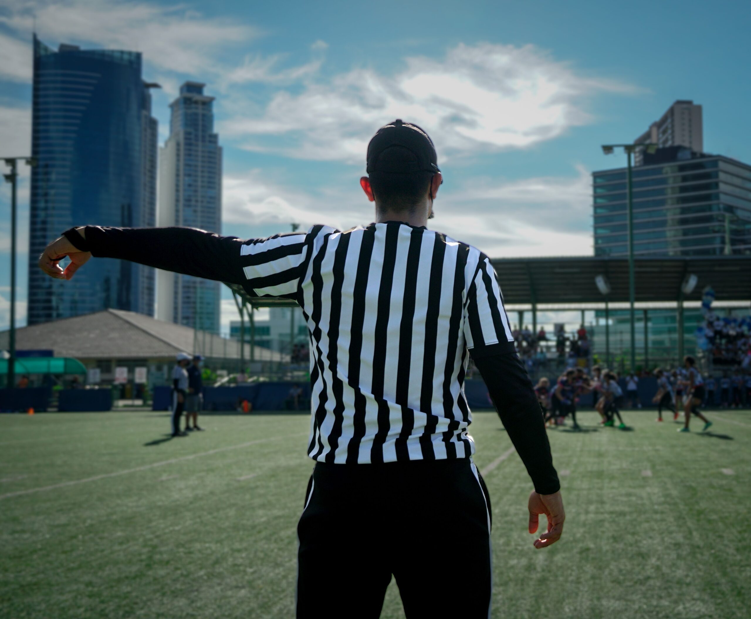 Rear view of a male referee in a field raising his left arm to the side rear view of a male referee in a field raising his 2026 01 07 07 16 34 utc scaled