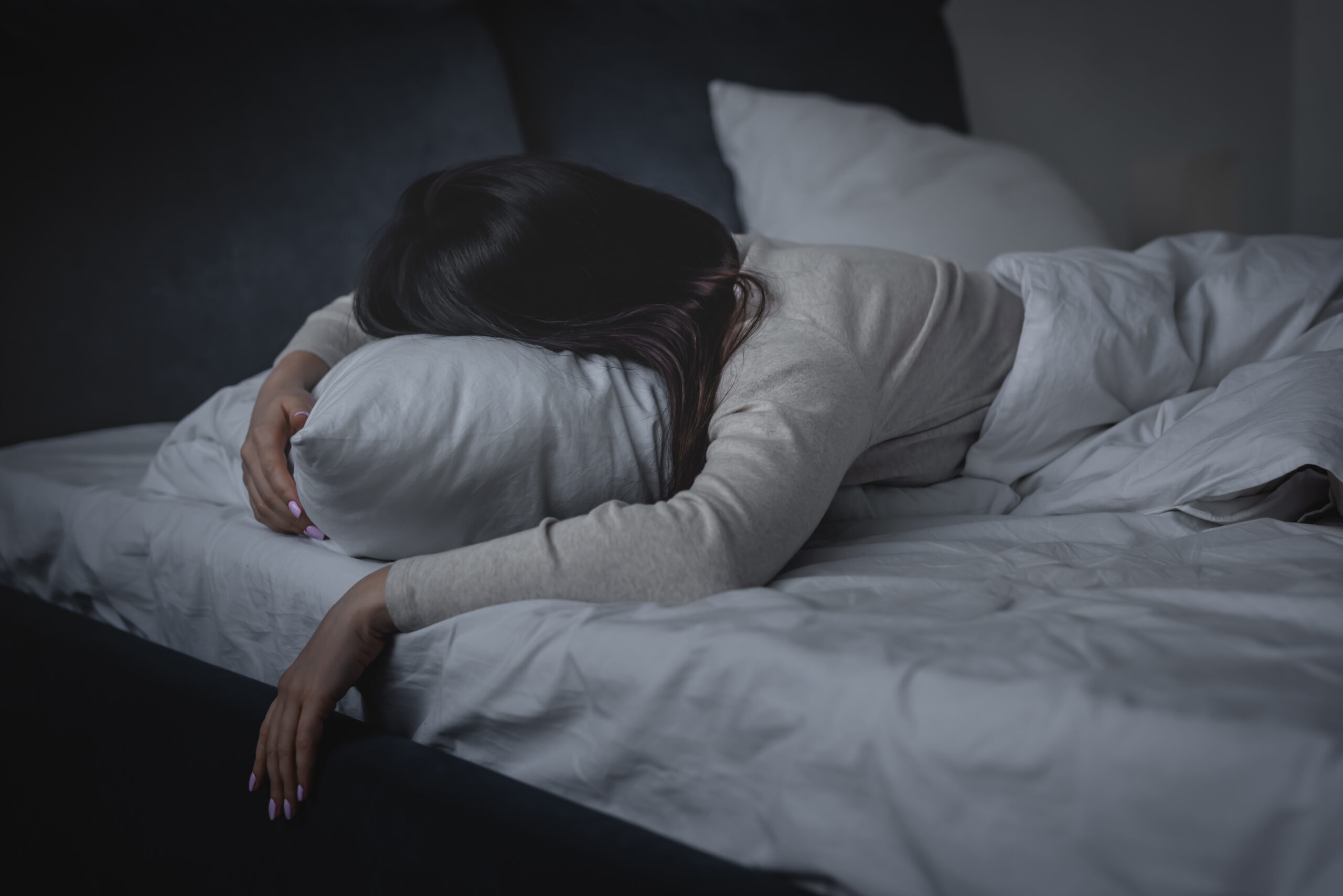 woman lying prone on pillow in bed 2026 01 06 00 40 16 utc scaled