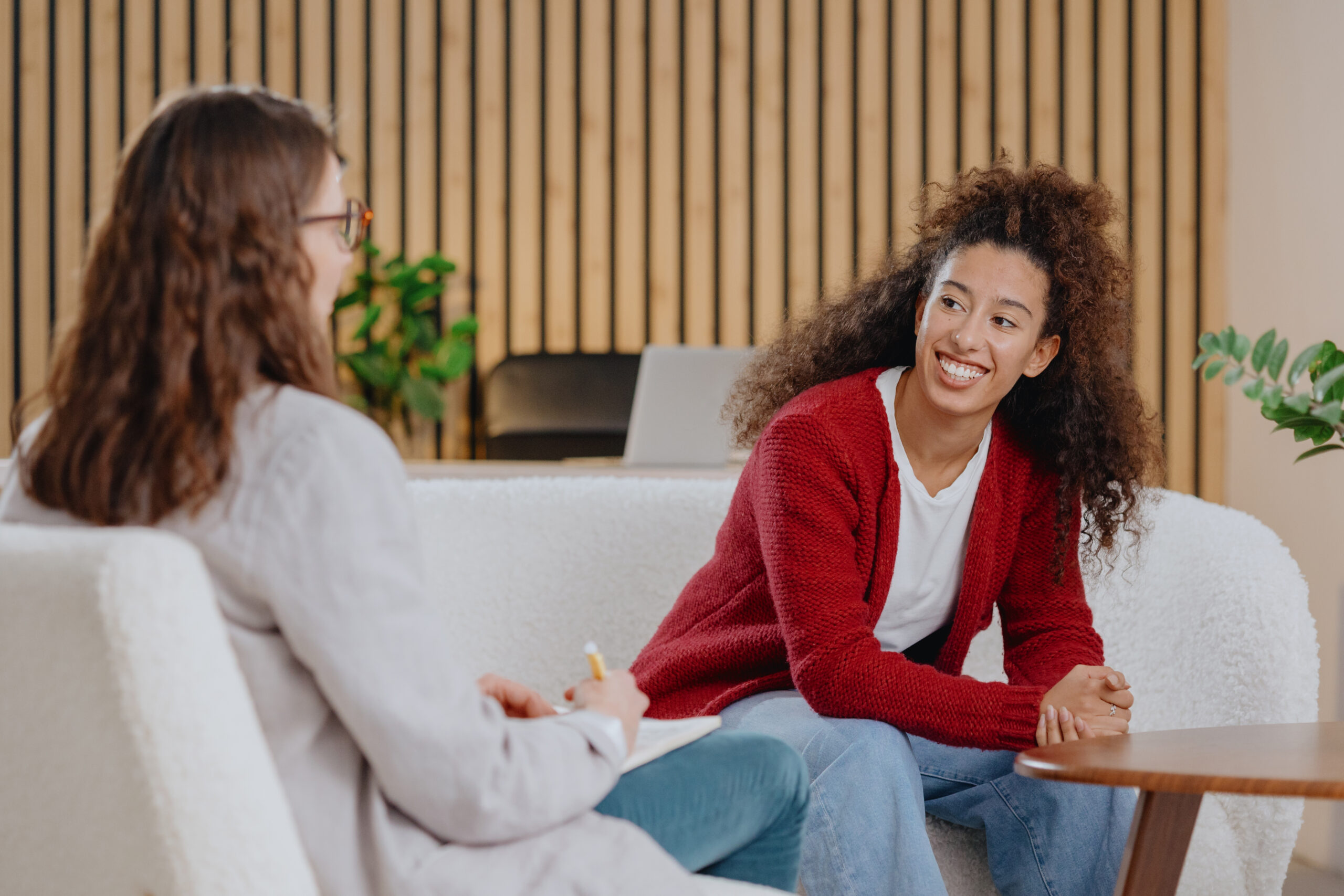 young woman talking during therapy session with co 2026 09 07 15 34 26 utc scaled